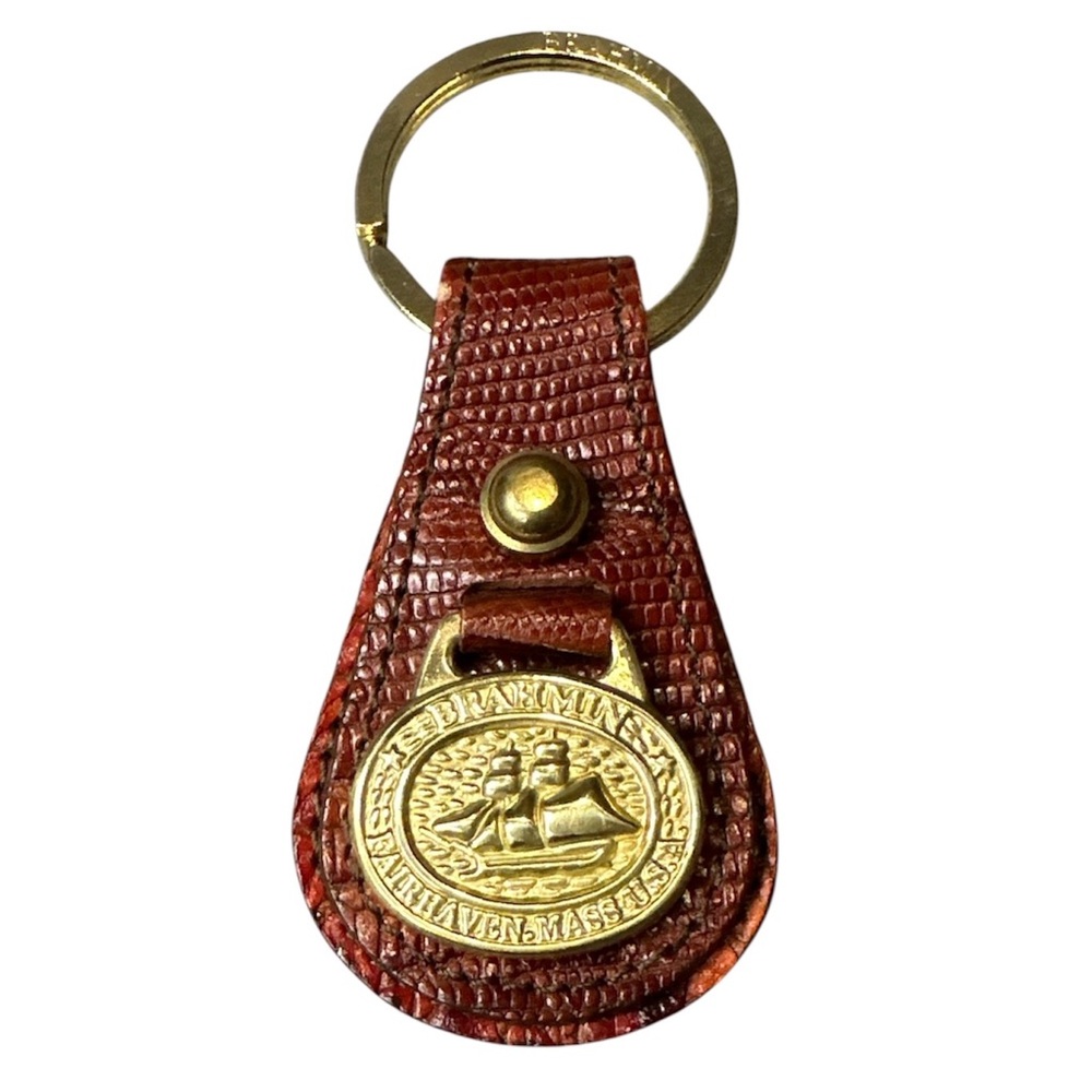 Vintage Brahmin leather keychain fob with gold accent logo emblem